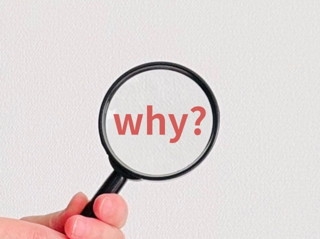 虫眼鏡と「why?」の文字